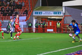 Doncaster Rovers' Caolan Lavery heads home beyond Crawley Town goalkeeper Corey Addai to give the visitors the lead.