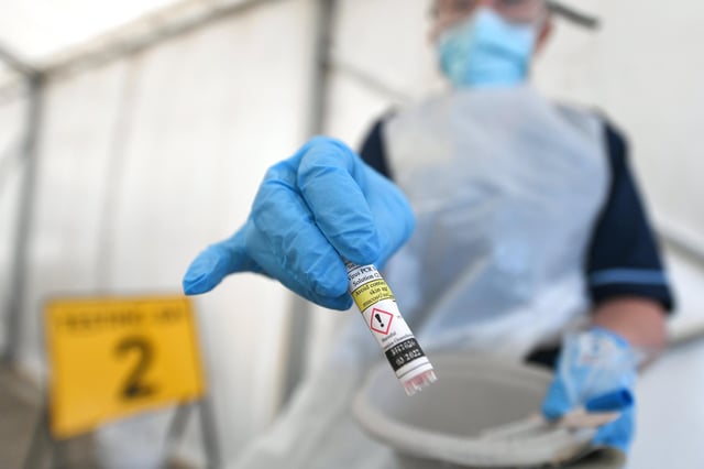 Picture : John Devlin. 16/04/2020. GLASGOW. Gartnavel General Hospital.
Stock shot of Covid-19 testing centre. Nurse manager, Jean Stevenson at the centre.
Less than half UK's Covid-19 testing capacity being used, figures show.
No 10 suggests NHS should refer more staff for tests as 15,994 carried out in 24 hours.
No 10 has said the country now has the capacity to test more than 35,000 hospital patients, NHS staff and care workers a day for coronavirus but questions are mounting about why less than half of those tests are currently being carried out.
While the government is aiming for 100,000 tests a day, just 15,994 tests were carried out in the 24 hours before 9am on Wednesday.
This is despite capacity at NHS and Public Health England laboratories of 20,771 tests and 14,300 at 26 privately operated drive-through sites across the country.
'Absolutely wrong': how UK's coronavirus test strategy unravelled
Read more
No 10 suggested the NHS needed to refer more staff for testing but also said it was looking at widening the eligibility for testing.
“We are very clear that we want the NHS to be making use of any additional capacity which exists,†a Downing Street spokesman said.
“We have more to do in relation to testing. We need to reach 100,000 tests by the end of the month and that is what we are working hard on.
“Testing is going to be hugely important to finding the key to unlocking the way out of this pandemic and we need to keep working hard at it.â€
The government had targeted a goal of ramping up testing at NHS and PHE laboratories to 25,000 a day by the middle of April. It appears now to have met that capacity with the help of private drive-through sites, despite Matt Hancock, the health secretary, denying that target at Wednesday’s press conference.
Advertisement
However, it is still a long way from actually completing the number of tests that it has the capacity to process.
Experts have warned that mass testin