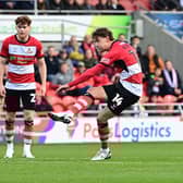 Harrison Biggins takes a first-half free-kick.