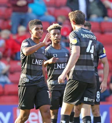 Tyreece John-Jules is congratulated after netting his first goal for Rovers. Picture: Gareth Williams/AHPIX