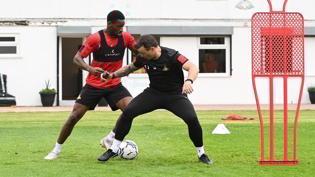 Omar Bogle, pictured with Rovers assistant boss Noel Hunt, has been one of the players to have impressed Richie Wellens the most this week