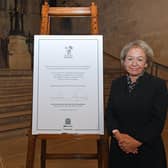 Dame Rosie with the signed Armed Forces Covenant. Credit: ©UK Parliament/Jessica Taylor