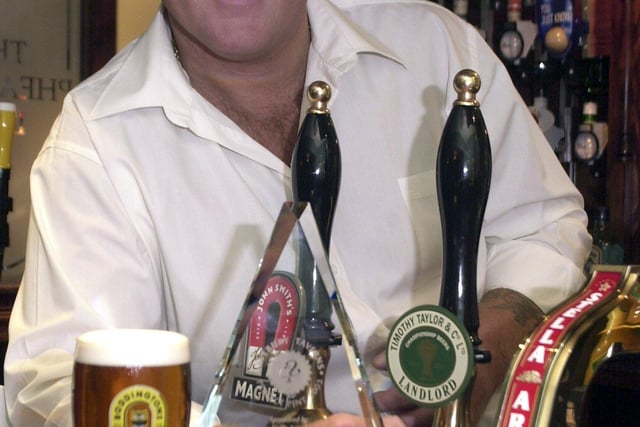 Carl Travers shows off a freshly pulled 'perfect pint' at his pub, The Pheasant Inn, in Sheffield.