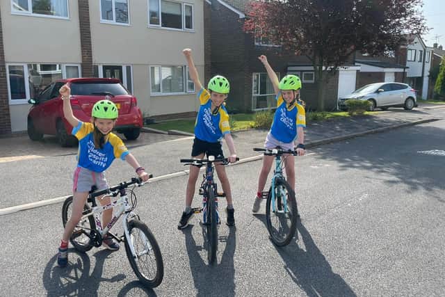 Ellena, Isobel and Abigail on their bikes ready for the triathlon