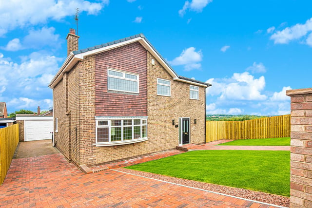 This five bedroom house has a modern large conservatory.