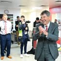 Terry Bramall celebrates with the Rovers players post-match.
