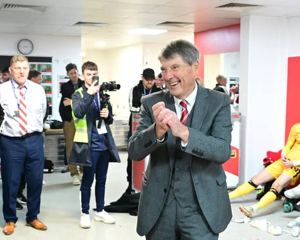 Terry Bramall celebrates with the Rovers players post-match.