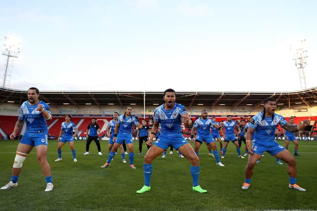 Members of Samoa perform the Siva Tau ahead of kick off during the Rugby League World Cup 2021 Pool A match between Samoa and Greece at the Eco-Power Stadium. Photo: Charlotte Tattersall/Getty Images for RLWC