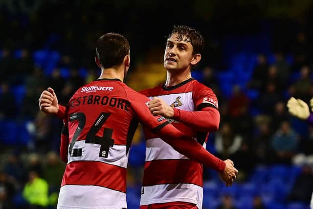 Harrison Biggins celebrates his goal with Zain Westbooke.