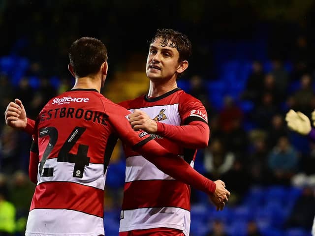 Harrison Biggins celebrates his goal with Zain Westbooke.