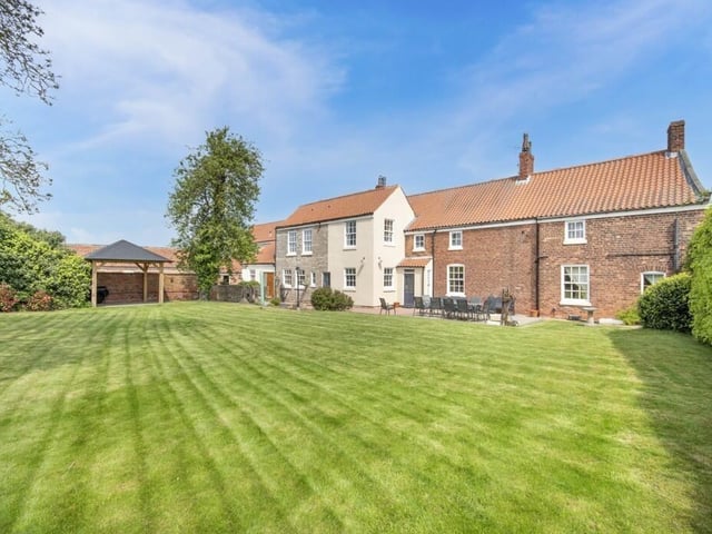 A view of the property from its lawned gardens.