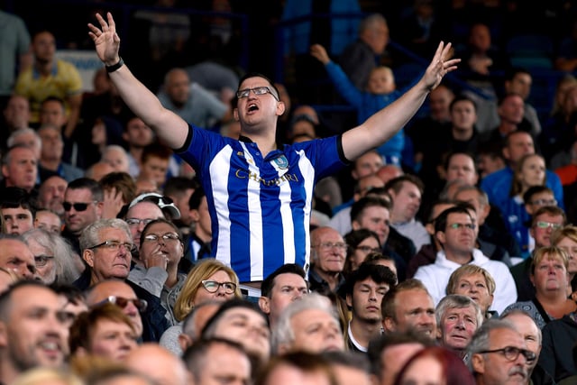 A Wednesday fan gets behind his side during the Sky Bet Championship clash against Ipswich Town at Hillsborough in August 2018.
