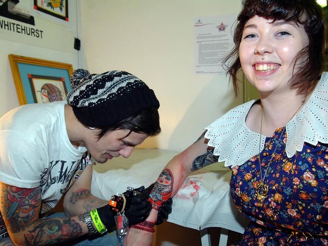 2012 Tattoo Jam at Doncaster Racecourse and Exhibition Centre. Limited Edition tattooist Luke Whitehurst tattoos a russian doll on Rosie Halstead (20) from Hyde Park.