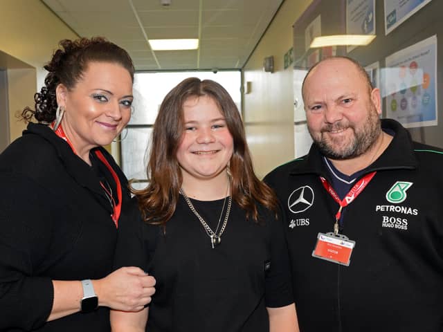 Kobi Laybourne, 11, pictured with his parents Kelly and Paul before the event. Picture: NDFP-14-02-20 AshHill CharityHaircut 1-NMSY