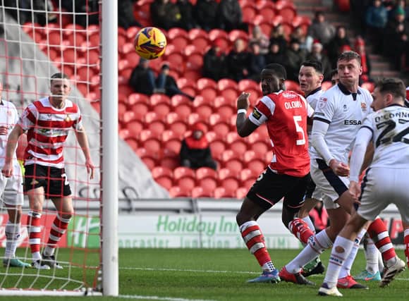 Picture Howard Roe/AHPIX LTD; Football, SkyBet; League Two;
Doncaster Rovers v Tranmere Rovers;
21/12/2024 12.30 pm; Eco-Power Stadium;
Doncasters' Joseph Olowu watches his header into the net