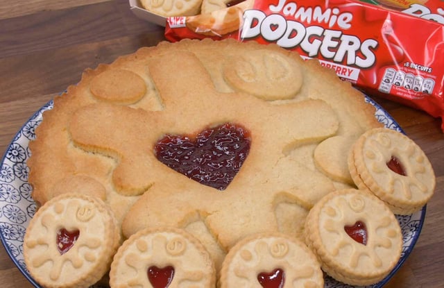 The giant Jammie Dodger - and how it sizes up to the shop-bought biscuit. Picture: B&M.
