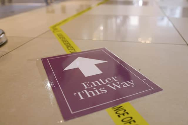 New measures include floor markings and physical boundaries to ensure safe social distancing for customers and colleagues.