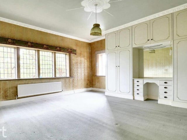 One of five double bedrooms, some of which have original mullion windows.