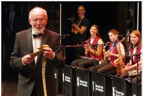 John Ellis was presented with a gold tie to mark 50 years leading Doncaster Youth Jazz Association. (Photo: DYJA).