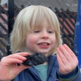 A delighted Noah with his coal