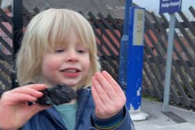A delighted Noah with his coal