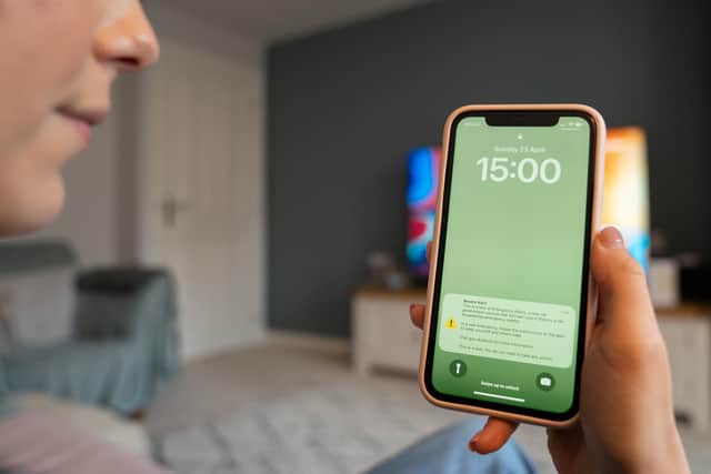 A file photo of a test of a public alert system on a mobile phone. Mobile phones will ring out with an alarm this September as the Government tests its emergency alert system.