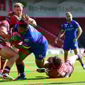 Dons' Albert Vete drives to the try line against Oldham. Picture: Howard Roe/AHPIX.com