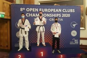 Bradly Sinden (centre) on the -68kg podium