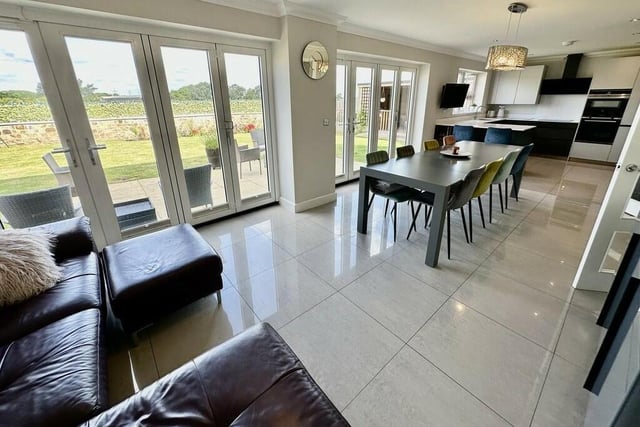 The open plan living kitchen, with bi-fold doors out to the garden.