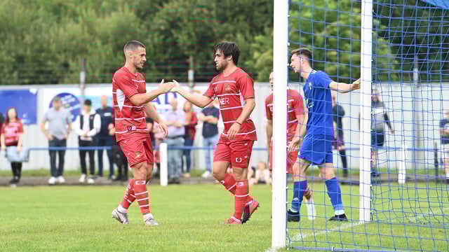 Aiden Barlow celebrates his opening goal with Tommy Rowe. Picture: Howard Roe/AHPIX