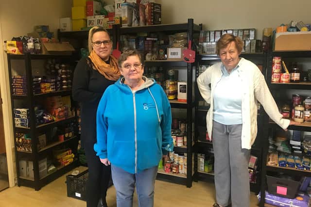 Sam Siddall and other volunteers at the food bank.