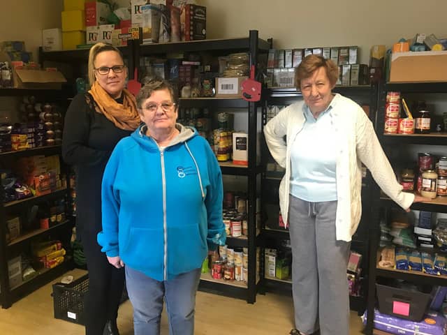 Sam Siddall and other volunteers at the food bank.