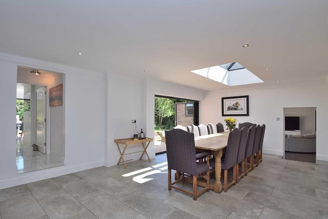 The impressive formal dining room stretches to 31ft in total, offering plenty of space for entertaining, and is bright and airy thanks to a roof lantern and bi-folding doors.