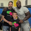 James Kirsopp and his son with Doncaster Rovers FC legend JK Akinfenwa at the 2023 charity match for the Eve Merton Dreams Trust.