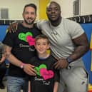 James Kirsopp and his son with Doncaster Rovers FC legend JK Akinfenwa at the 2023 charity match for the Eve Merton Dreams Trust.