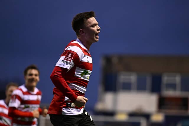 Patrick Kelly celebrates the match-winner at Barrow.