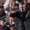 Gary McSheffrey in discussion with Frank Sinclair at Fleetwood Town. Picture: Howard Roe/AHPIX LTD
