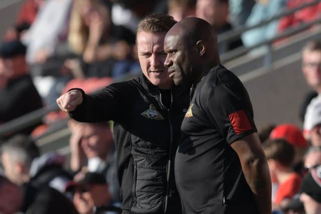 Gary McSheffrey in discussion with Frank Sinclair at Fleetwood Town. Picture: Howard Roe/AHPIX LTD