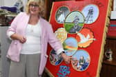 Artist Chris Teal with the colourful banner commemorating Askern Colliery and the Miners' Strike.