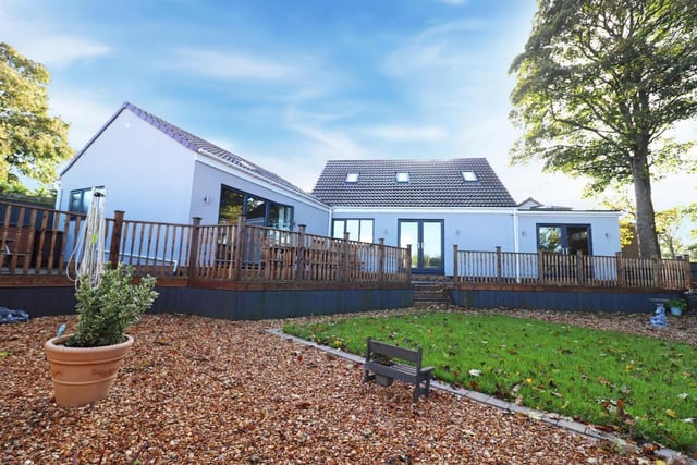 The rear garden has easy access to the the hot tub, living room and kitchen through a blend of French and bifold doors.