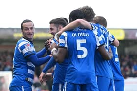 Luke Molyneux celebrates his second goal with his teammates. Picture: Howard Roe/AHPIX LTD
