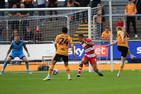 Newport County's Will Evans fires home his second goal against Doncaster Rovers to make it 4-0.