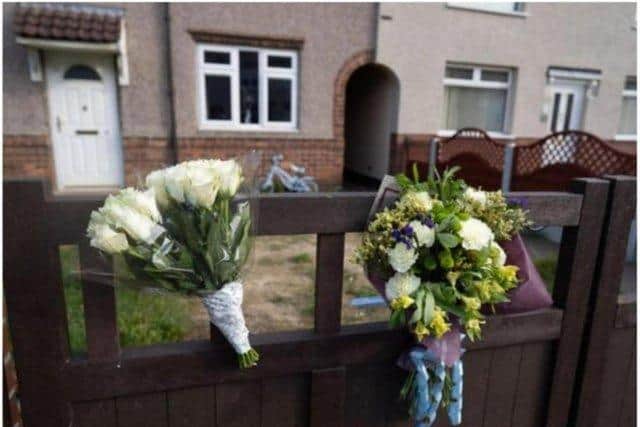 Flowers were left outside the home of Elon Ellis-Joynes after he was mauled to death by a dog in Doncaster