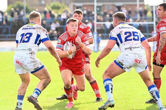 Jake Sweeting drives forward for the Dons. Picture by Howard Roe/AHPIX.com