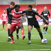 Taylor Richards tries to get the better of Wigan's Curtis Tilt. Picture: Howard Roe/AHPIX