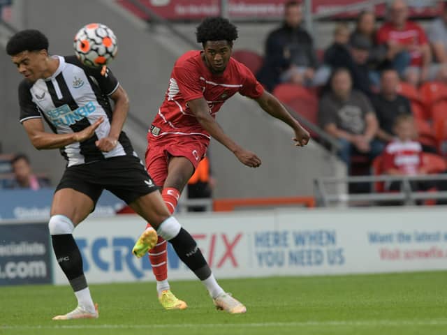 Trialist Shayon Harrison curls a shot onto the crossbar against Newcastle United. Picture: Howard Roe/AHPIX