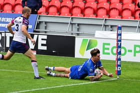 Olly Butterworth scores Dons' second try against Midlands Hurricanes.