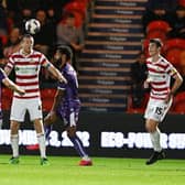 Doncaster Rovers are nicely in touch with the play-offs after the win at Grimsby Town.