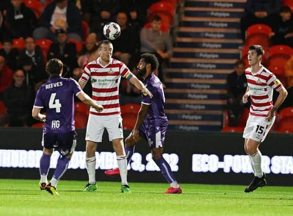 Doncaster Rovers are nicely in touch with the play-offs after the win at Grimsby Town.