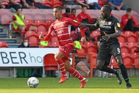 Rodrigo Vilca takes on Morecambe's Toumani Diagouraga. Photo: Andrew Roe/AHPIX LTD